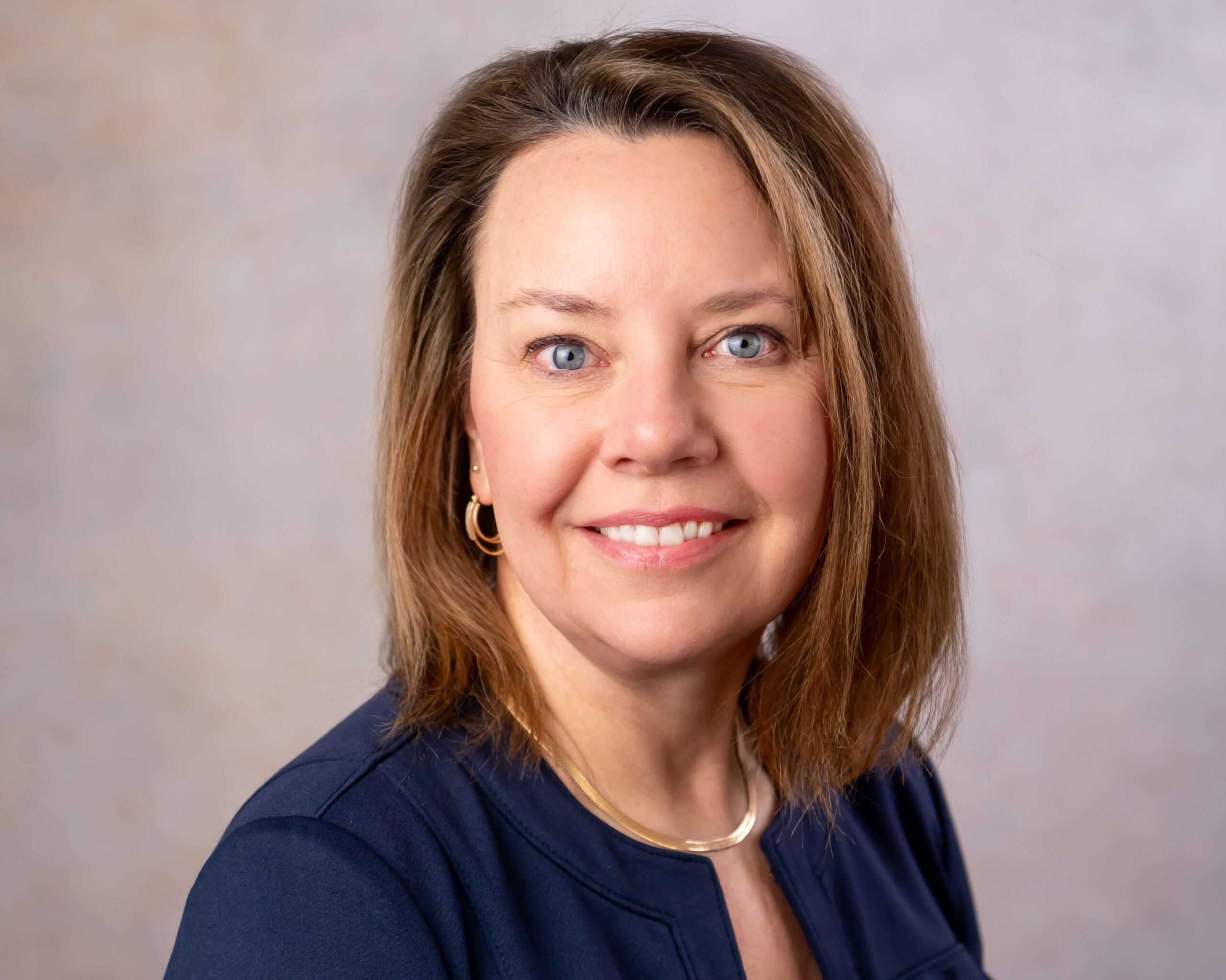 woman with gold earrings