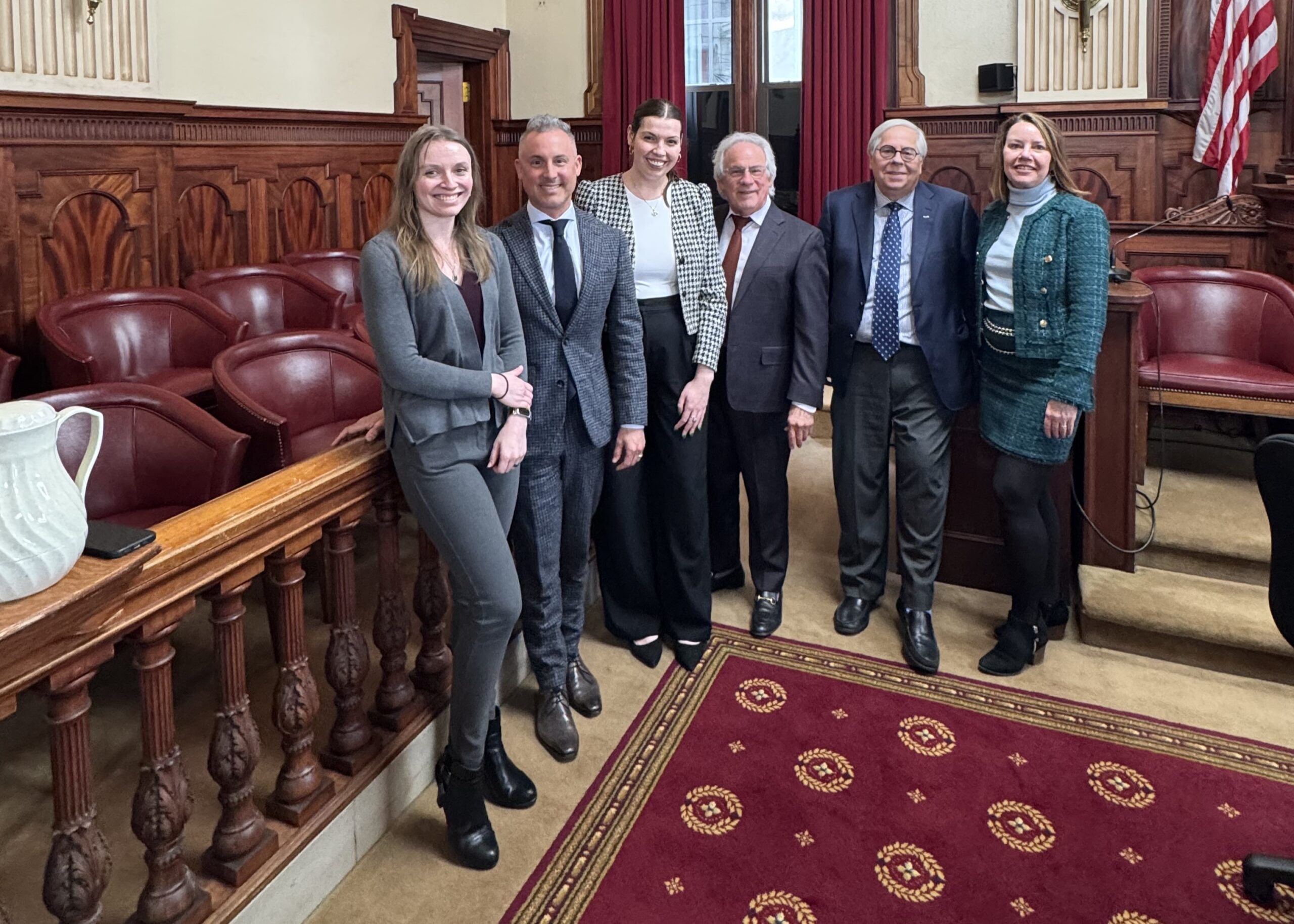WCB New attorney group of attorneys in a courtroom