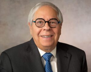 man with round glasses