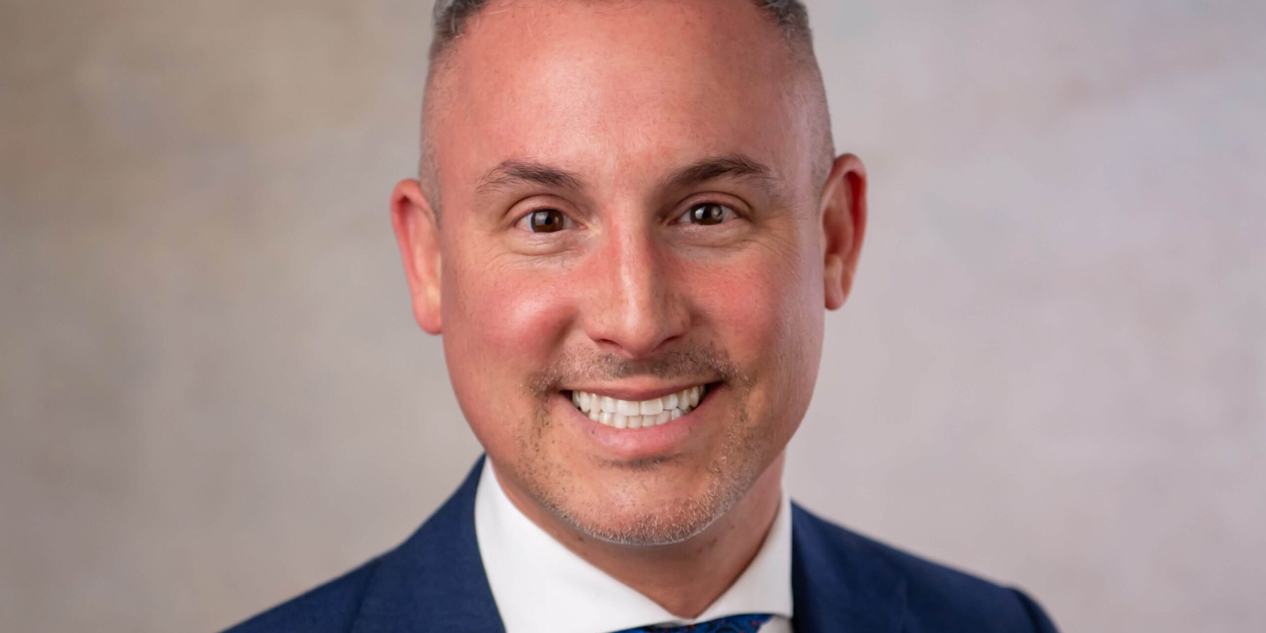 smiling man with brown eyes