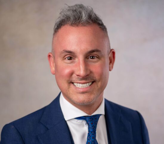 smiling man with brown eyes