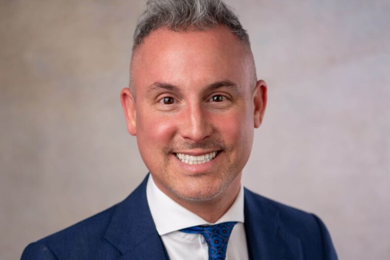 michael_web smiling man with brown eyes