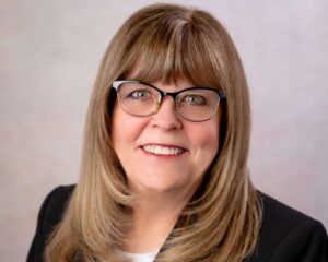 woman with glasses and honey blond hair