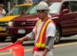 construction worker with orange flag