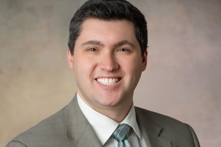 smiling young man in suit