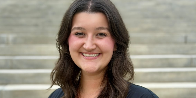 Emma Grace Cowan Smiling woman in dark blouse