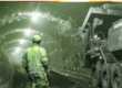 coal miner in tunnel with large equipment